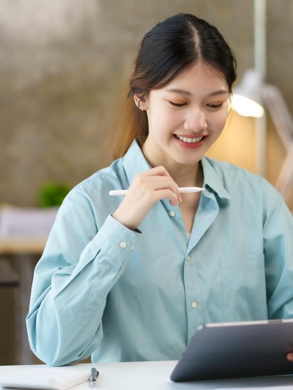 portrait-of-young-asian-business-woman-using-digital-tablet-in-the-office-.jpg